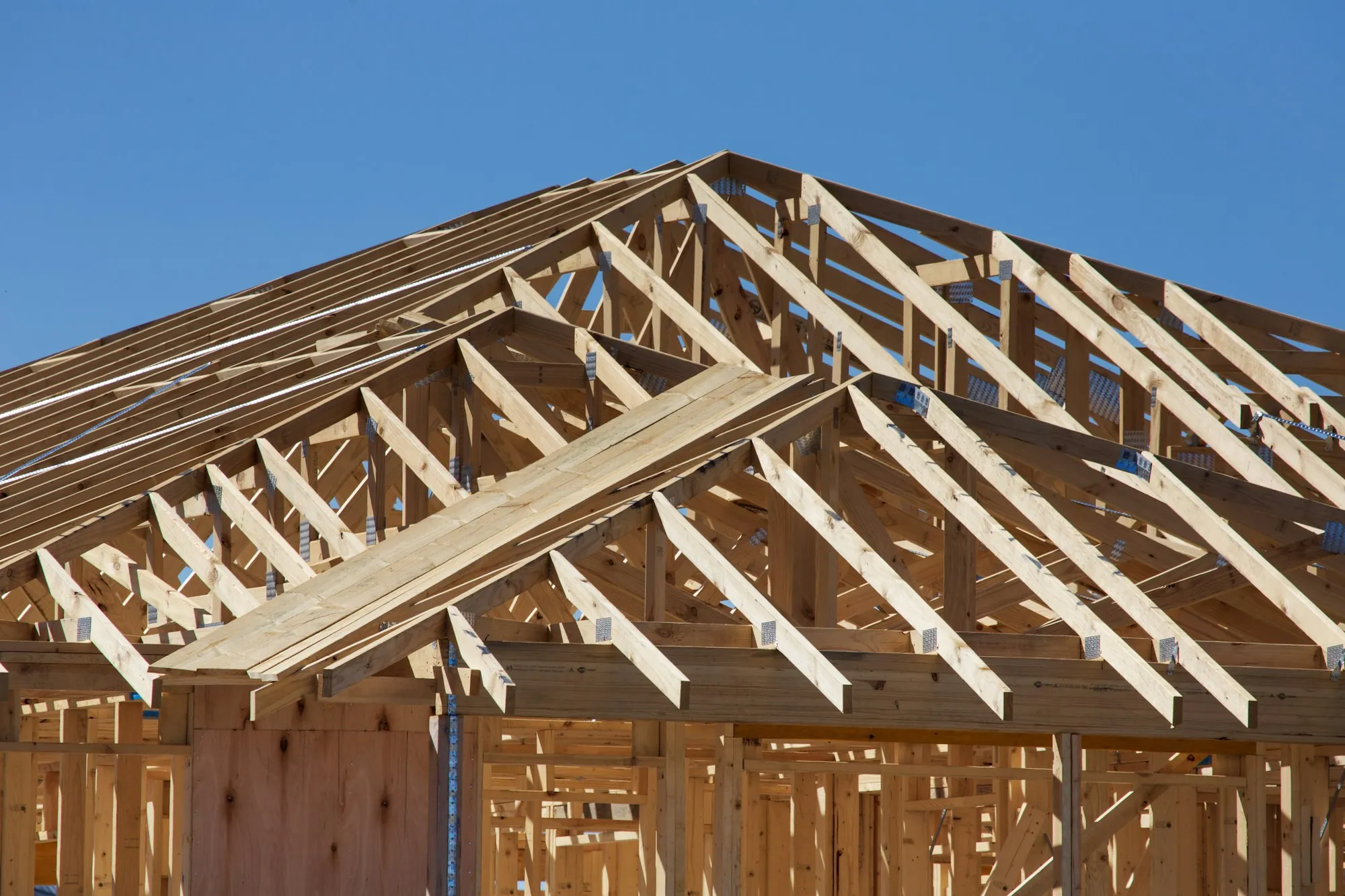 New roof trusses framed during a whole-home renovation
